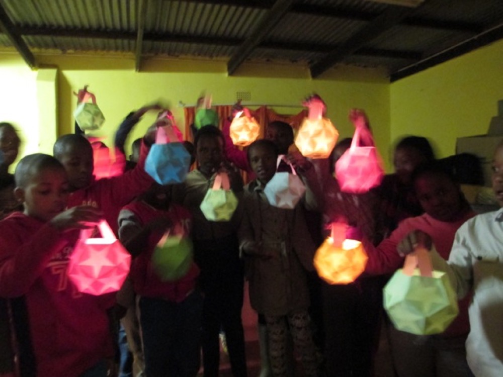 Lanterns carried through the dark